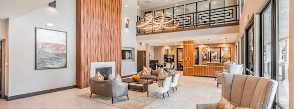 A living room with a fireplace and a painting on the wall. at Haven at Lewisville Lake Apartments, Lewisville, Florida