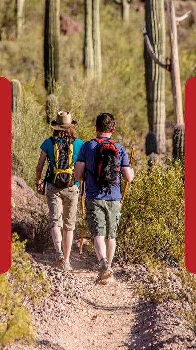 Man and Woman Hiking Together in Desert