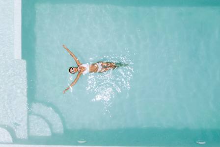 A person swimming in a pool.