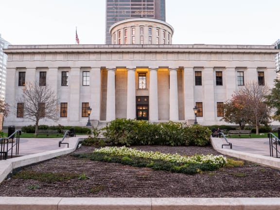a building with columns and a garden in front of itat Preston Centre, Ohio