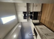 Thumbnail 45 of 51 - an overhead view of a kitchen with white cabinets and a counter top