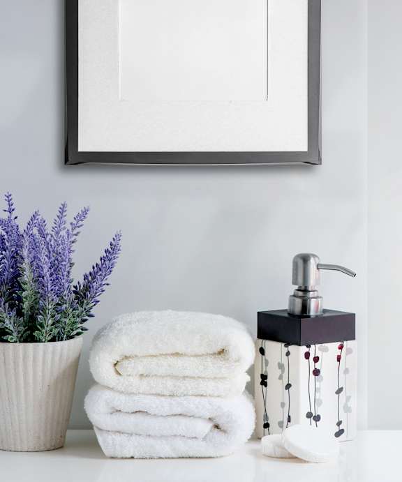 A white toilet sits next to a bathtub in a bathroom.