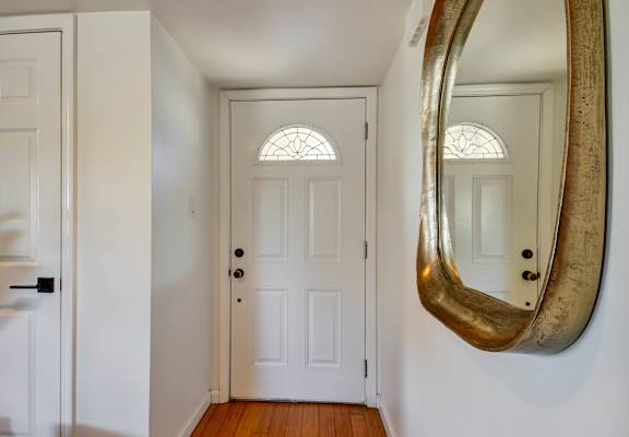 A white door with a glass window above it.