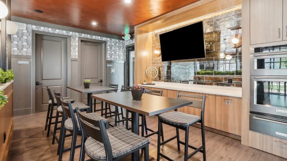 a dining room with a table and chairs in a kitchen