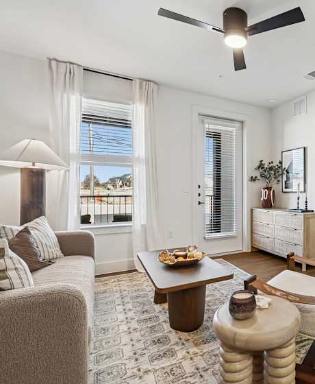 A living room with a couch, chair, and coffee table.