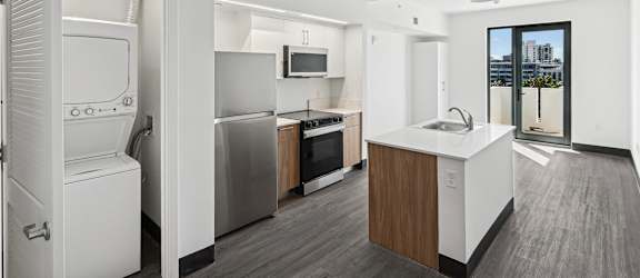 A modern kitchen with a view of the city.