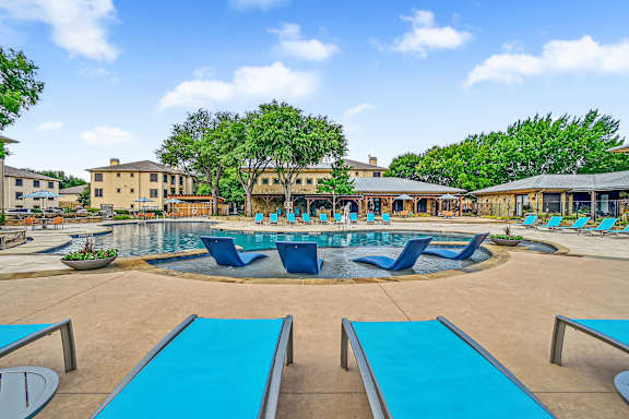 Poolside Relaxing Chairs at The Canyons Apartments, Texas, 76116