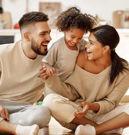 happy family sitting on the floor in the living room at Hamilton Manor Apartments, Hyattsville, 20782