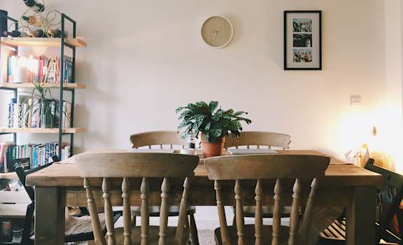 Dining area with wooden table and shelf