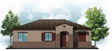 a small brick building with a red door