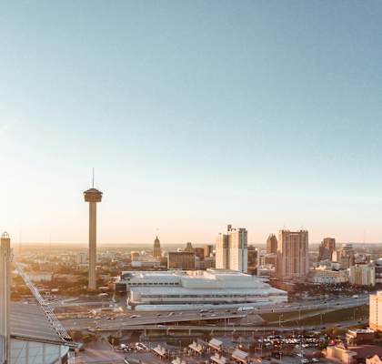 an aerial view of the city with the convention center and the tower