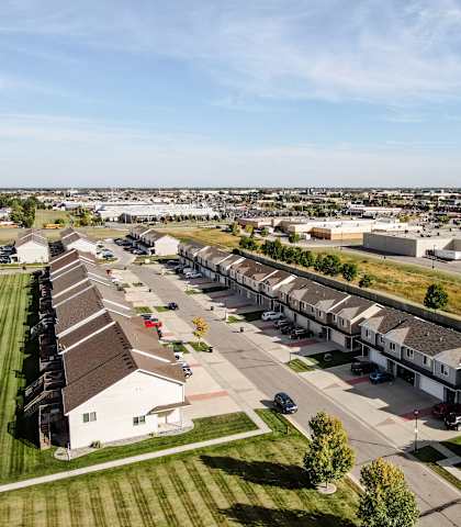 A suburban neighborhood with houses and apartment buildings.
