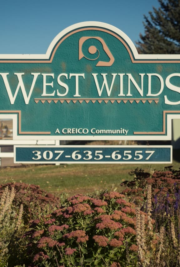 the sign at the entrance to west winds