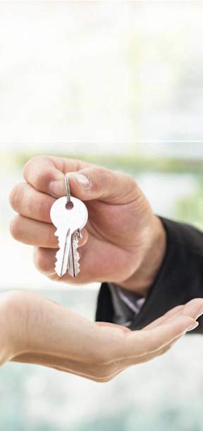 a person handing a keys to a hand with a hand holding a hand outstretched