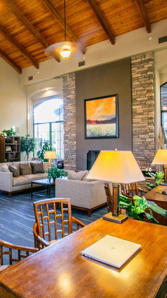 a living room with a table and chairs