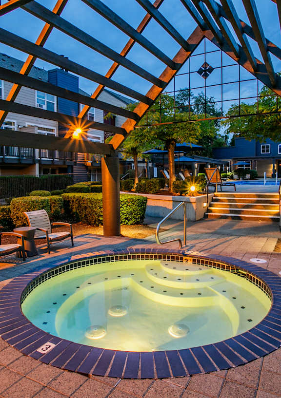 a patio with tables and chairs and umbrellas