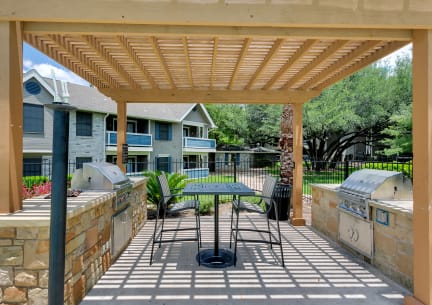 a kitchen with a stove and a window at Polo Clubs Apartments, Austin, TX 78729