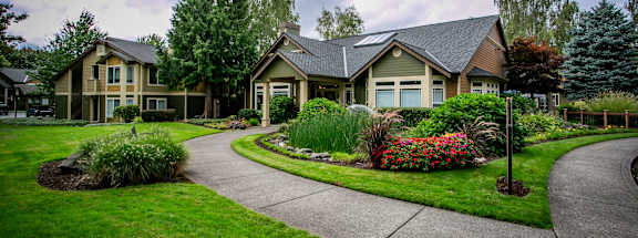 a house with a sidewalk in front of it