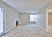 Thumbnail 14 of 28 - A spacious room with a fireplace and a window at Landmark at Lyncrest Reserve Apartments, Nashville, TN, 37209