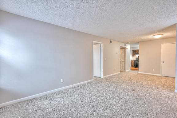 A spacious room with carpeted floor and white walls at Landmark at Lyncrest Reserve Apartments, Nashville, TN, 37209