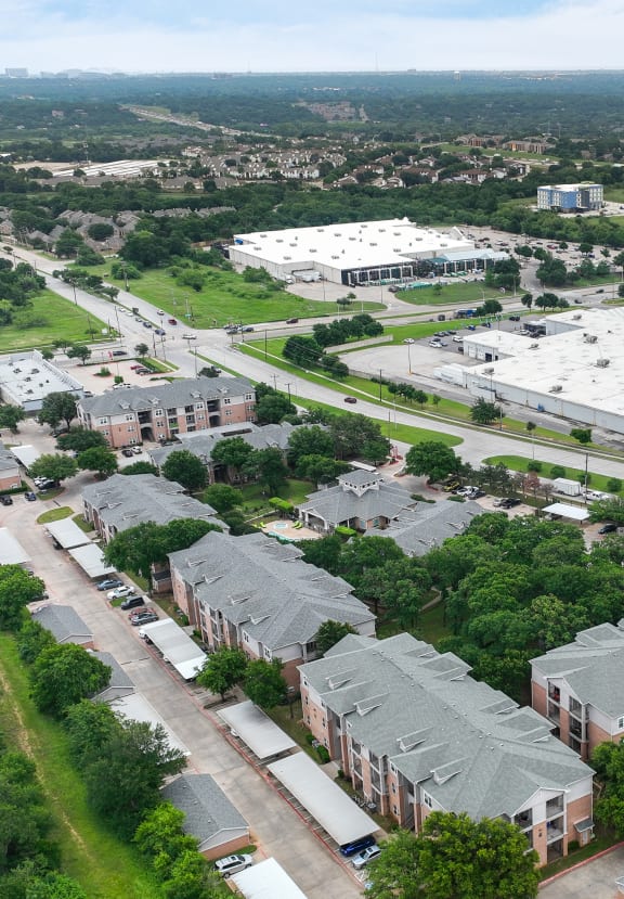 an aerial view of a neighborhood of houses in a city