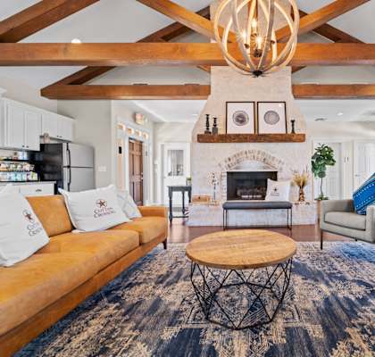 a living room filled with furniture and a fireplace