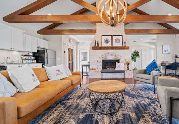 a living room filled with furniture and a fireplace