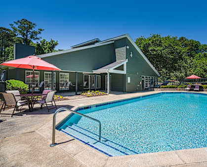 Sparkling Pool & Sundeck With Clubhouse Overlooking