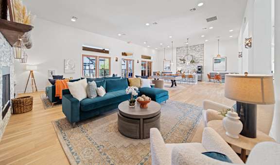 a living room with couches and chairs and a fireplace