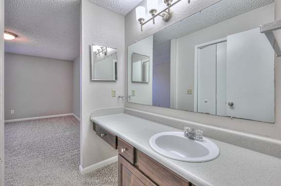 A bathroom with a sink, mirror, and medicine cabinet at Landmark at Lyncrest Reserve Apartments, Nashville, TN, 37209
