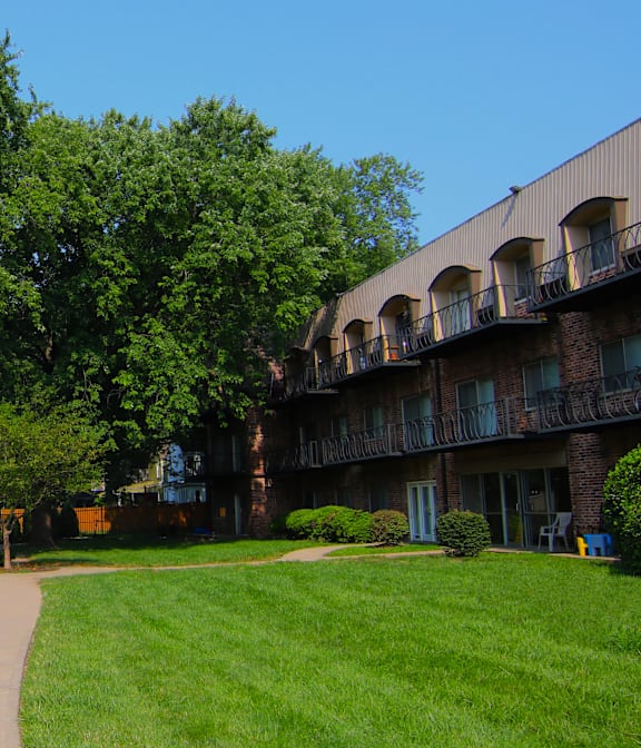 a walkway through the grassy area of an apartment complex at Waldo Heights, Kansas City