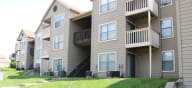 our apartments have a large yard for playing frisbee at Canyon Creek Apartments, Kansas City, 64132