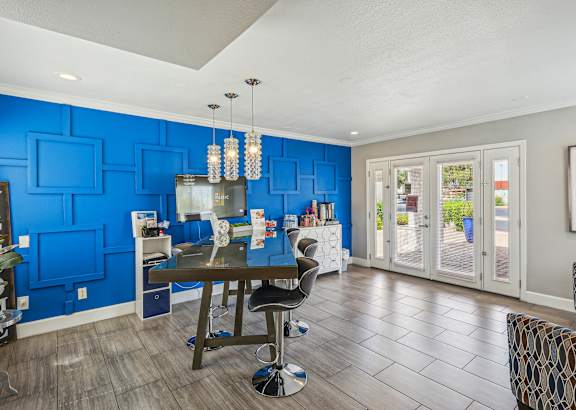 the preserve at ballantyne commons cyber cafe with blue walls and a wood floor