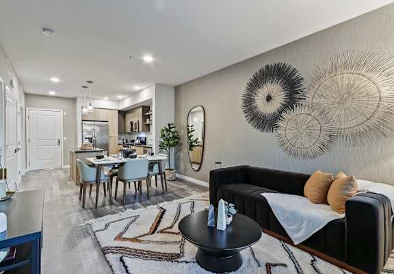 Living room and dining room with a kitchen in the background at Array La Mesa, La Mesa, 91942