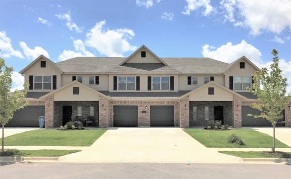 Building Exterior from the front showing attached garages and front doors