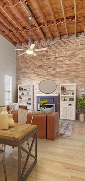 a dining room with a wooden table and chairs and a brick wall