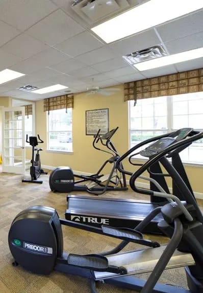 a gym with a lot of exercise equipment