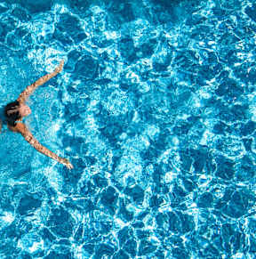 a woman swimming in a pool