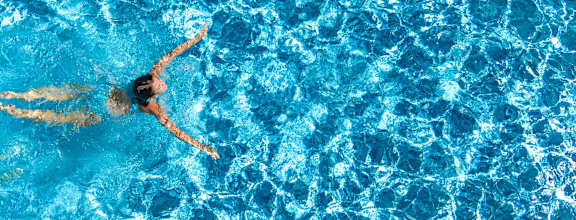 A person swimming in a pool.