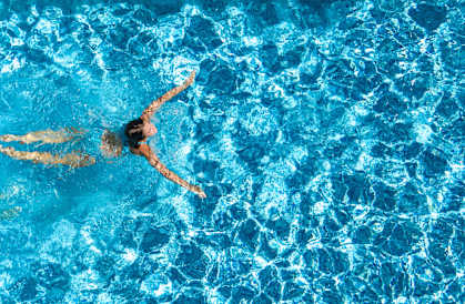 A person swimming in a pool.