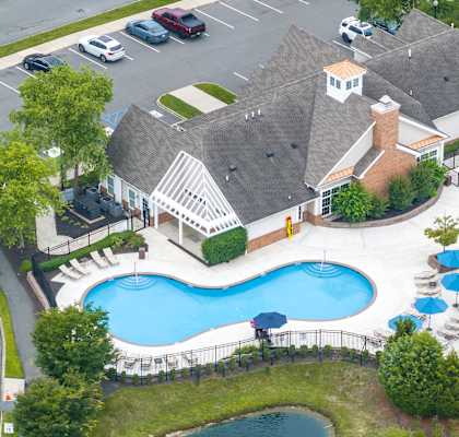 A large house with a pool in the backyard.