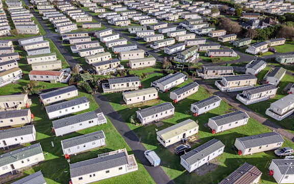 A large housing development with many identical houses.