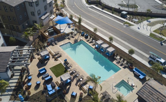 an aerial view of the resort style pool and hot tub