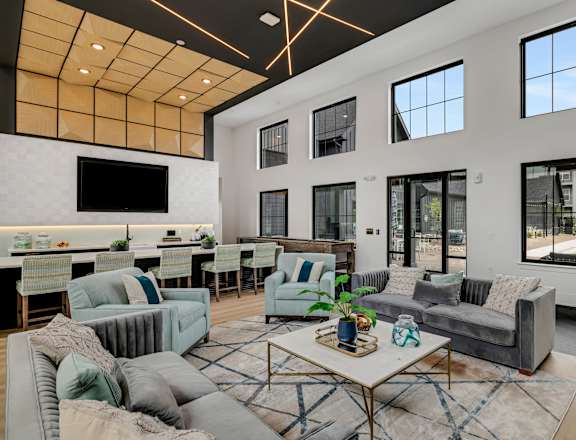 a living room filled with furniture and a large window  at Prism at Diamond Ridge, Moon Township, PA