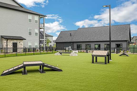 two picnic tables on a lawn in front of a building at Prism at Diamond Ridge, Moon Township, PA, 15108