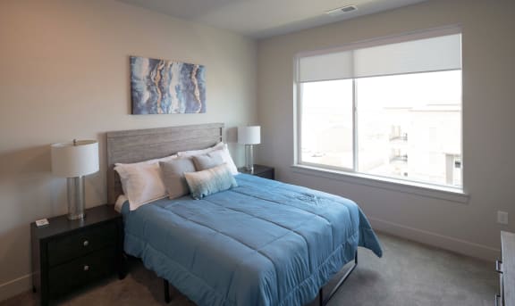 Bedroom With Expansive Windows at Soleil Lofts Apartments, Herriman, UT, 84096