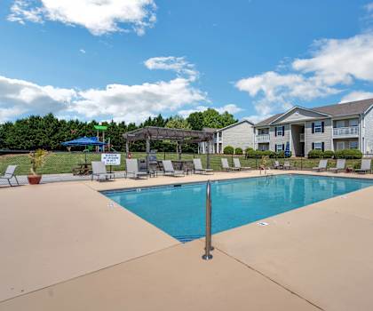 the preserve at ballantyne commons community swimming pool with house in the background