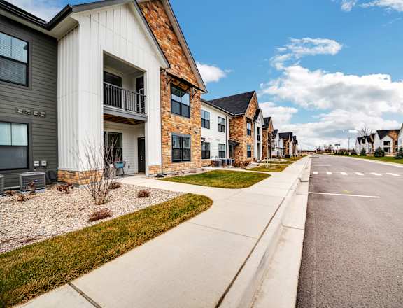 a row of houses on the side of a street at The BLVD at Wilson Crossings, Wyoming