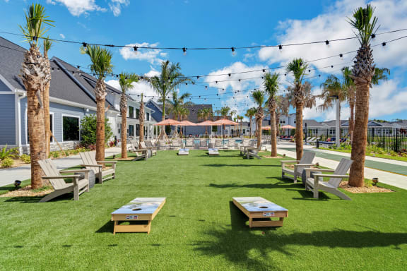 a grassy area with picnic tables and chairs  at The Sophia, Venice, FL, 34275