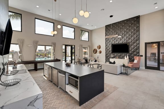 a kitchen with a large island in the middle of a living room  at The Sophia, Venice, Florida